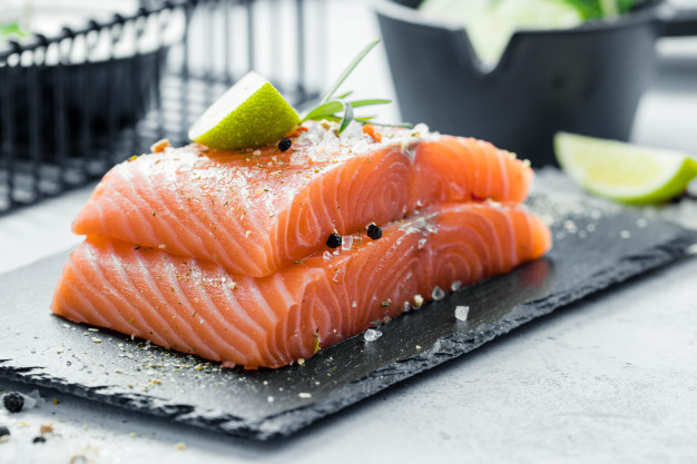 raw salmon fillet with fresh herb rosemary