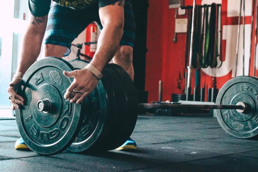 Weight Plates and man