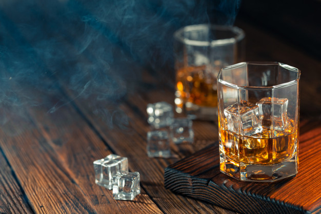 Whiskey in glass with ice