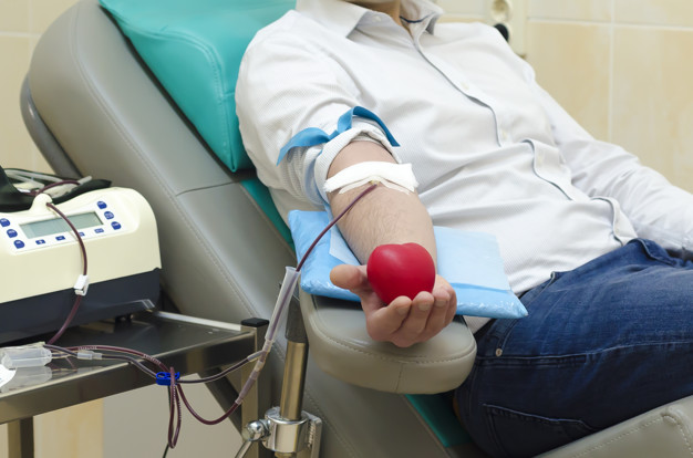 world-blood-donor-day-june-14th-hand-taking-blood-test-from-vein-donation-hemotransfusion-department-hospital-man-holds-bouncy-ball-form-heart-hand