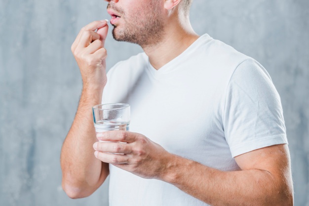 man taking medicine; healthy lifestyle