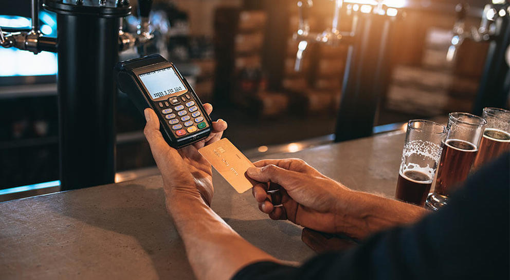 customer paying at bar