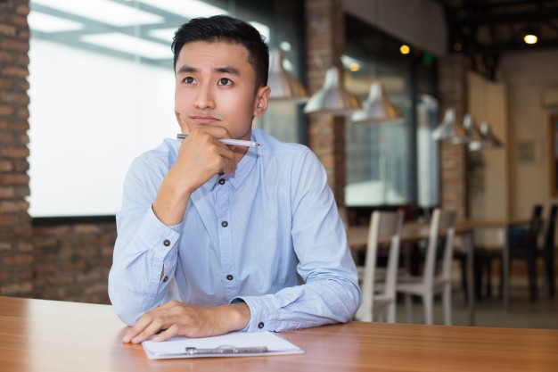 thoughtful concentrated young businessman at the office