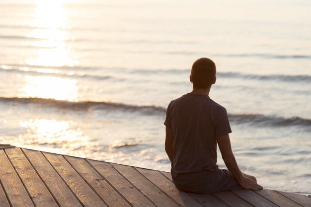 back-view-man-relaxing-beach-outside-with-copy-space