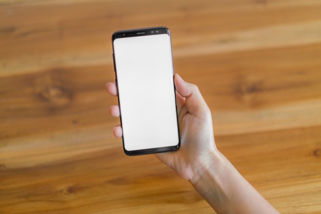 Business hand with mobile phone
