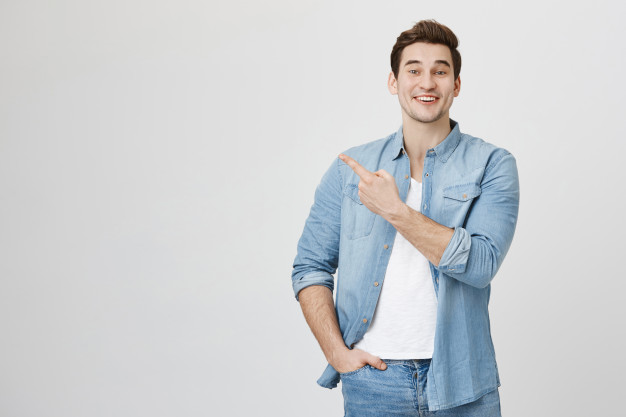 cheerful-man-pointing-finger-left-advertise-product