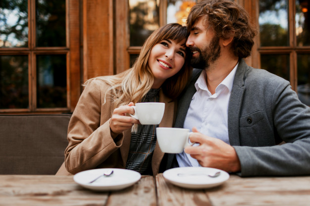 Couple in love sitting in a cafe