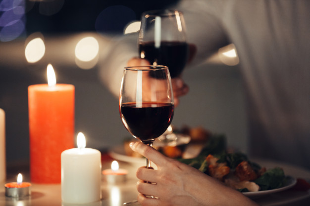 cropped-photo-lovers-having-romantic-dinner-home