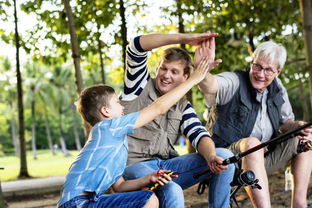 Family making a high five while fishing