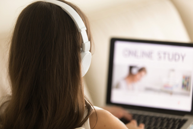 Female student choosing course for distance learn