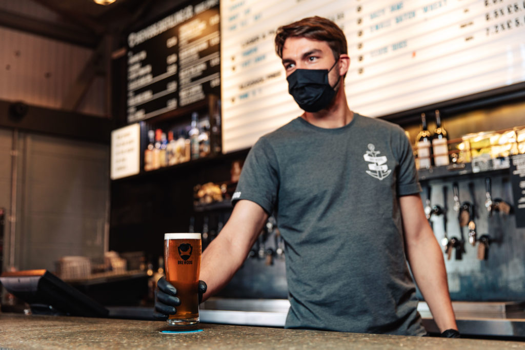 man wear mask at bar