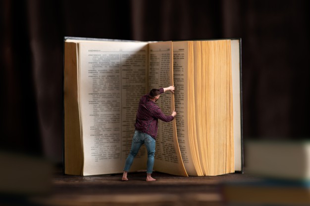 little-man-turns-page-large-book-scale-effect-gaining-knowledge-education-reading