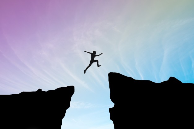 man-jump-through-gap-hill-man-jumping-cliff-blue-sky-business-concept-idea