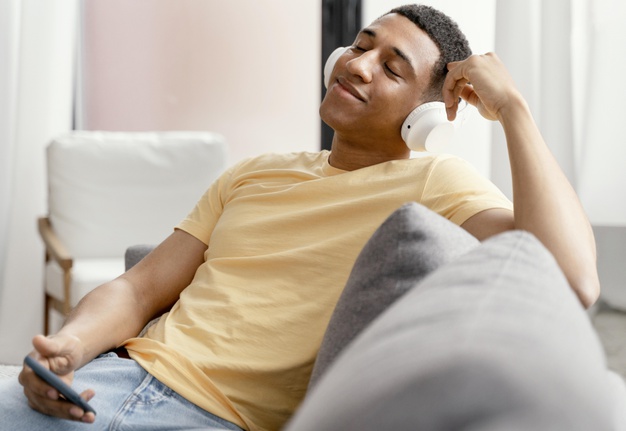 man listening with headphone