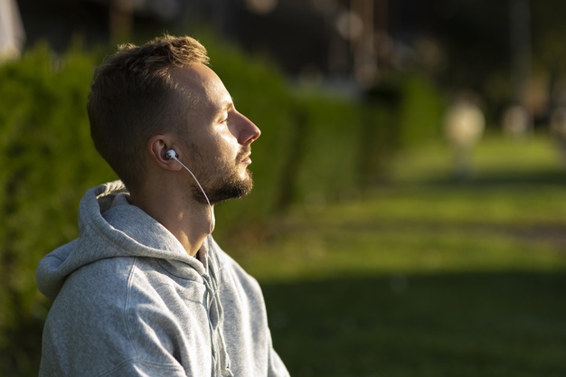 sideways-man-listening-music-while-meditating