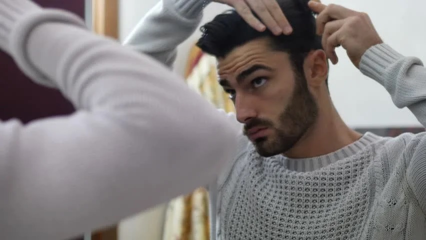 man combing hair