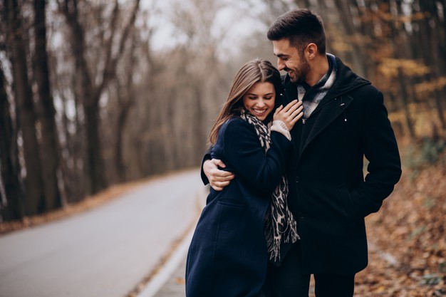 young-couple-together-walking-autumn-park
