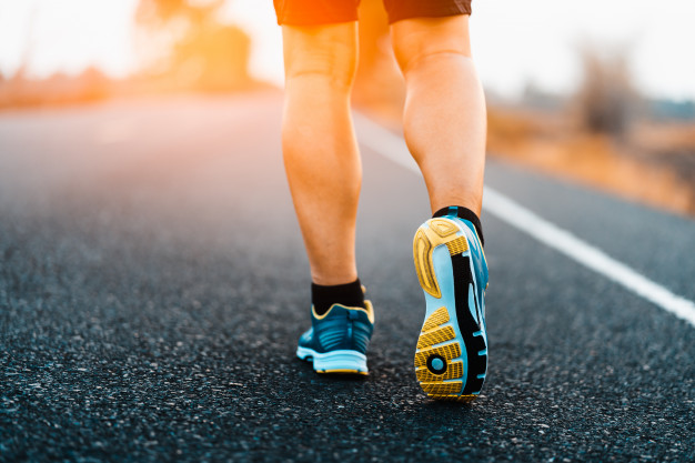 Athlete running sport feet on trail healthy lifestyle fitness