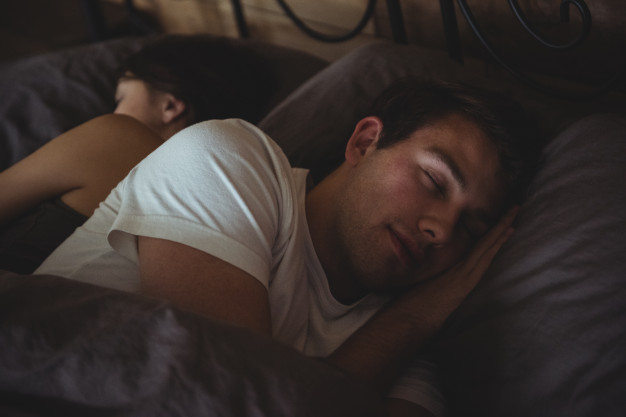 couple-sleeping-bed-bedroom