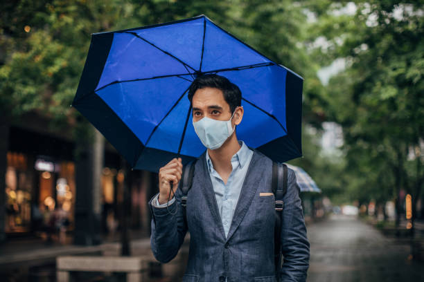 Businessman in the city on the rainy day