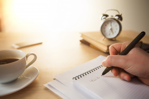 Male hand with a pen