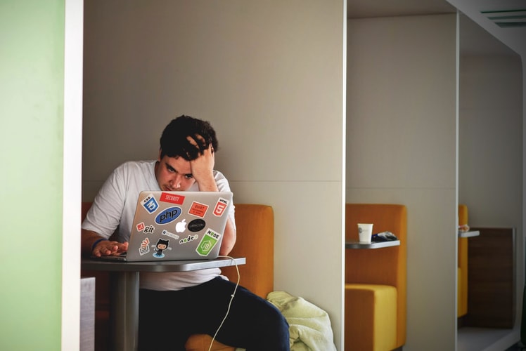 man feeling overwhelmed