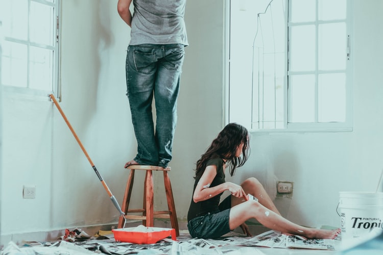 man painting wall