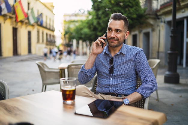 businessman in a formal outfit talking on the phone
