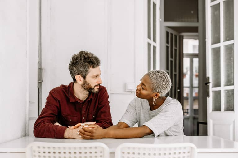 Cheerful lady talking with husband 
