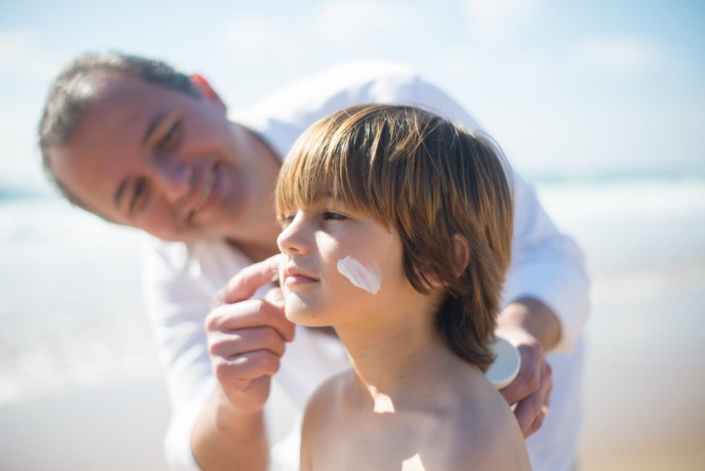 Applying sunscreen on The beach