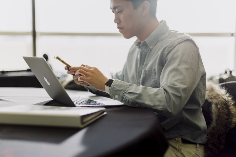 man working with laptop