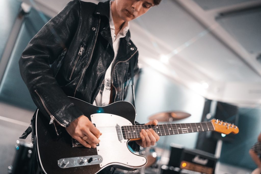 musician playing guitar