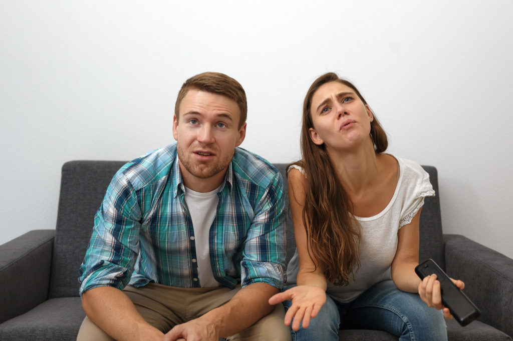  emotional young female and male gesturing and grimaci