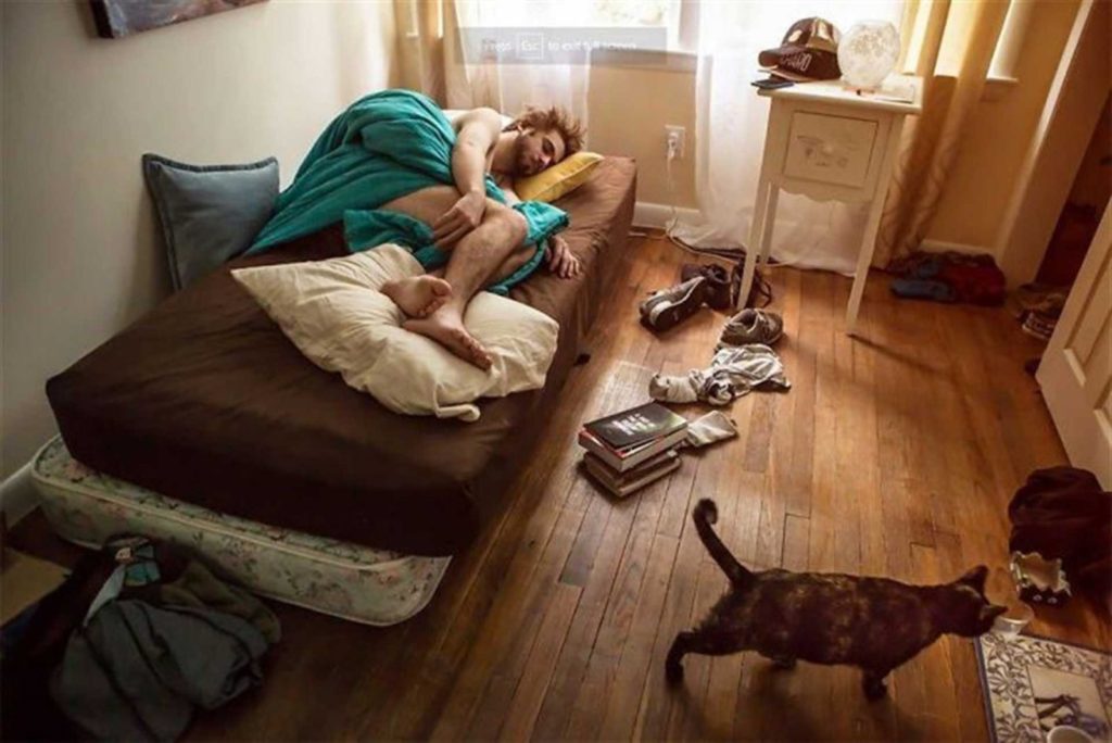 Young Man Lying Messy Bed 