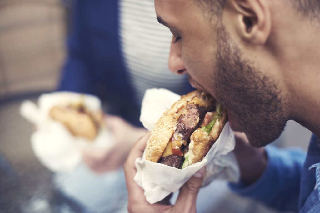Man Happy Eating Unhealthy Food Or Junk Food