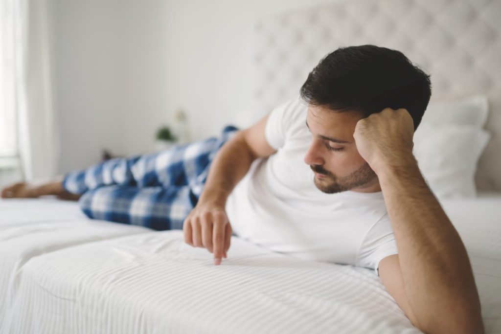  Lonely Man In Pajamas On Bed 