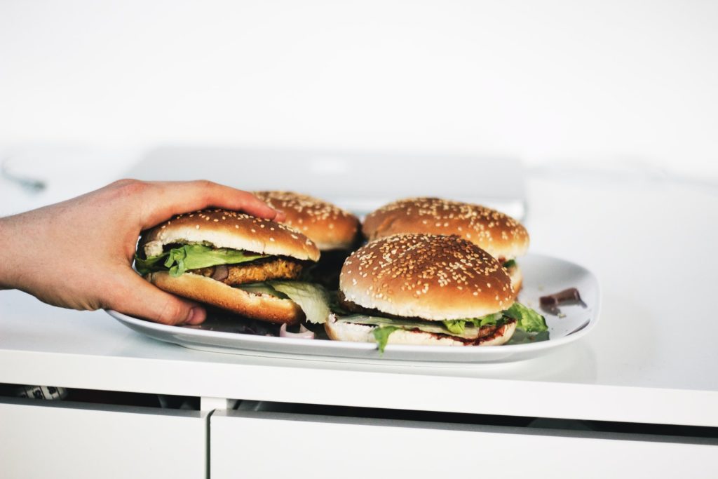hand and burgers