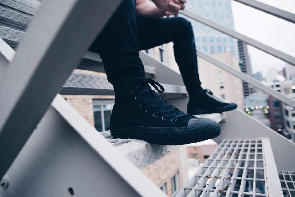 man wearing black sneaker