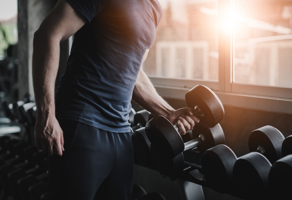 man lifting Dumbbell at gym