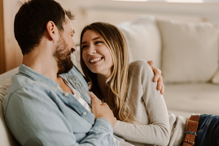 Happy Couple looking each other and laughing together