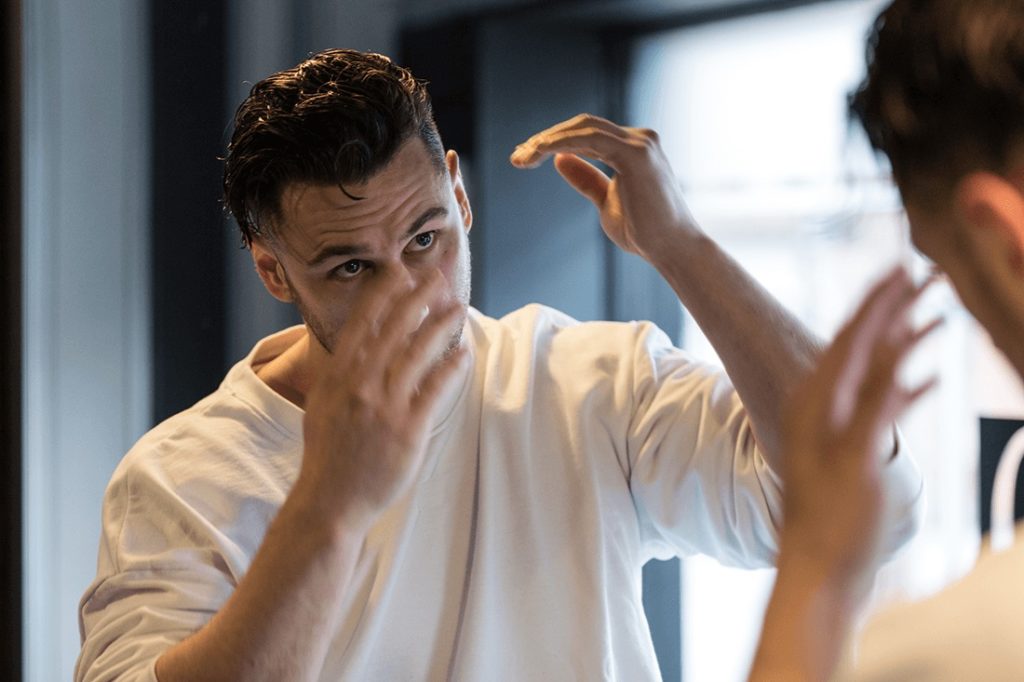 Man Fixing Hair