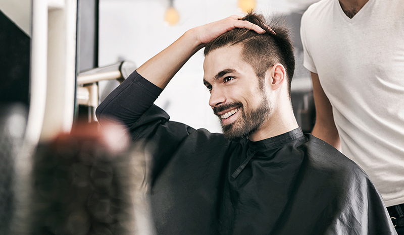  Handsome Young Man Touching His Hair With Hand And Smiling 