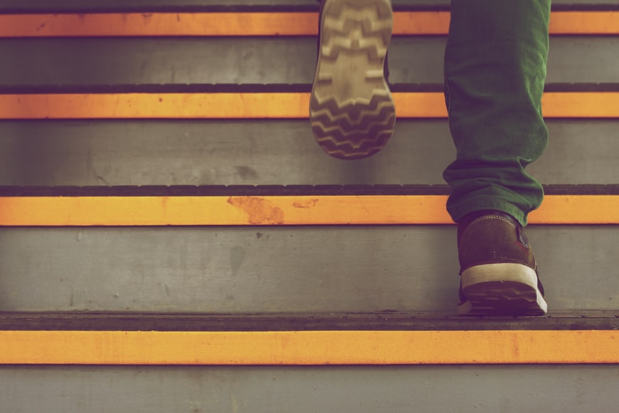 Man walking up stairs