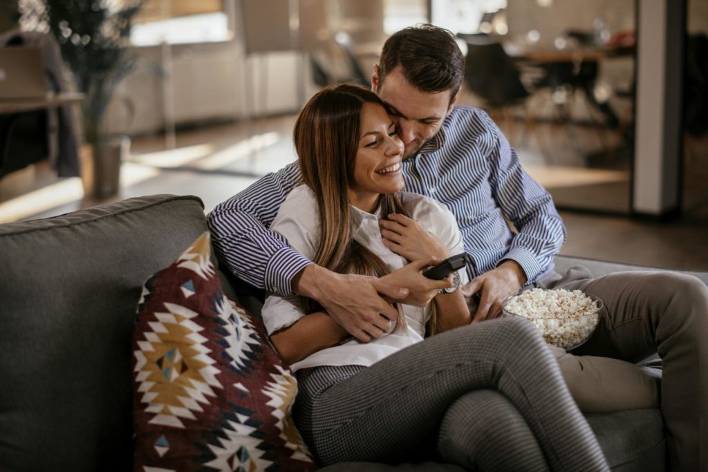 Couple sitting and laughing together 