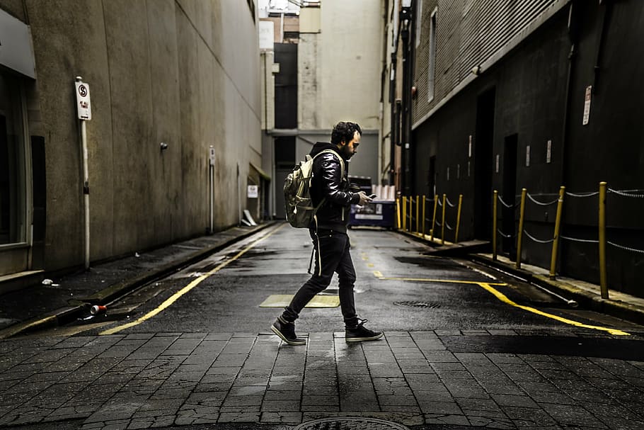 Young Man Walking Down The Street 