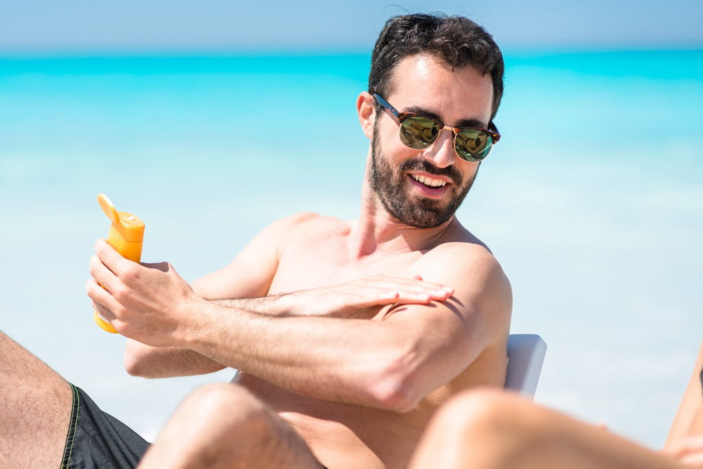 man Applying Sunscreen
