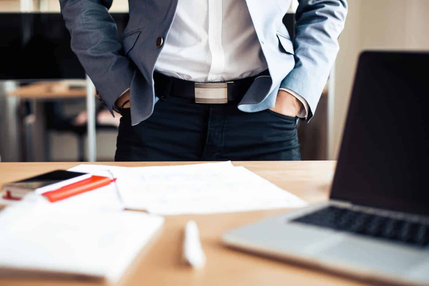 man standing at work table