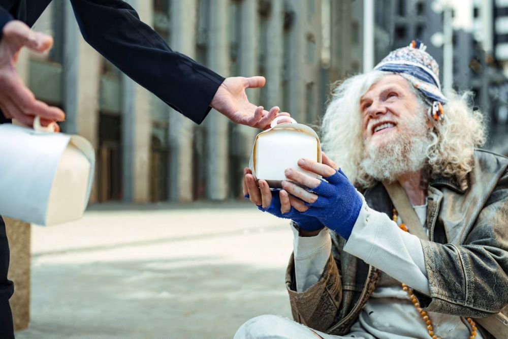 Charity Man Encouraging Other People Giving Food For Homeless 