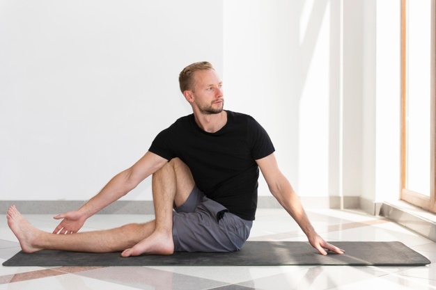 man stretching indoor  
