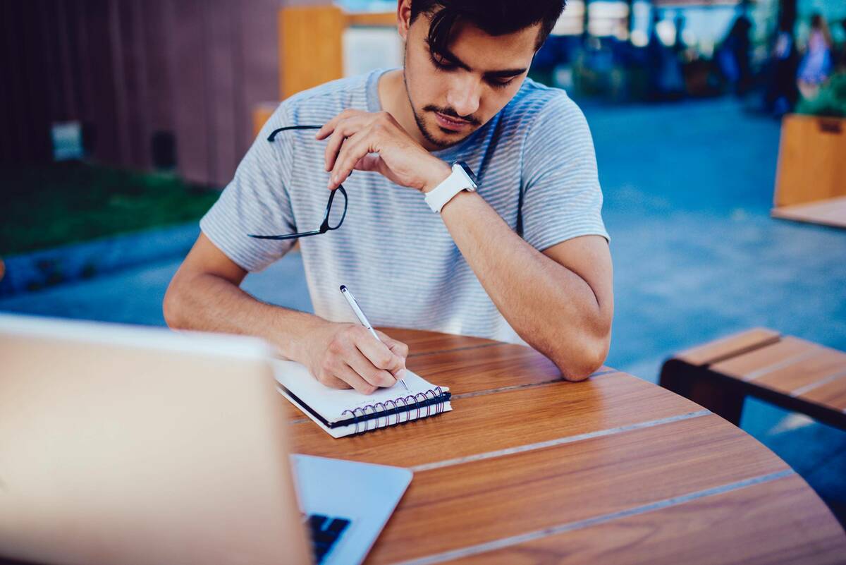Man Writing on note book